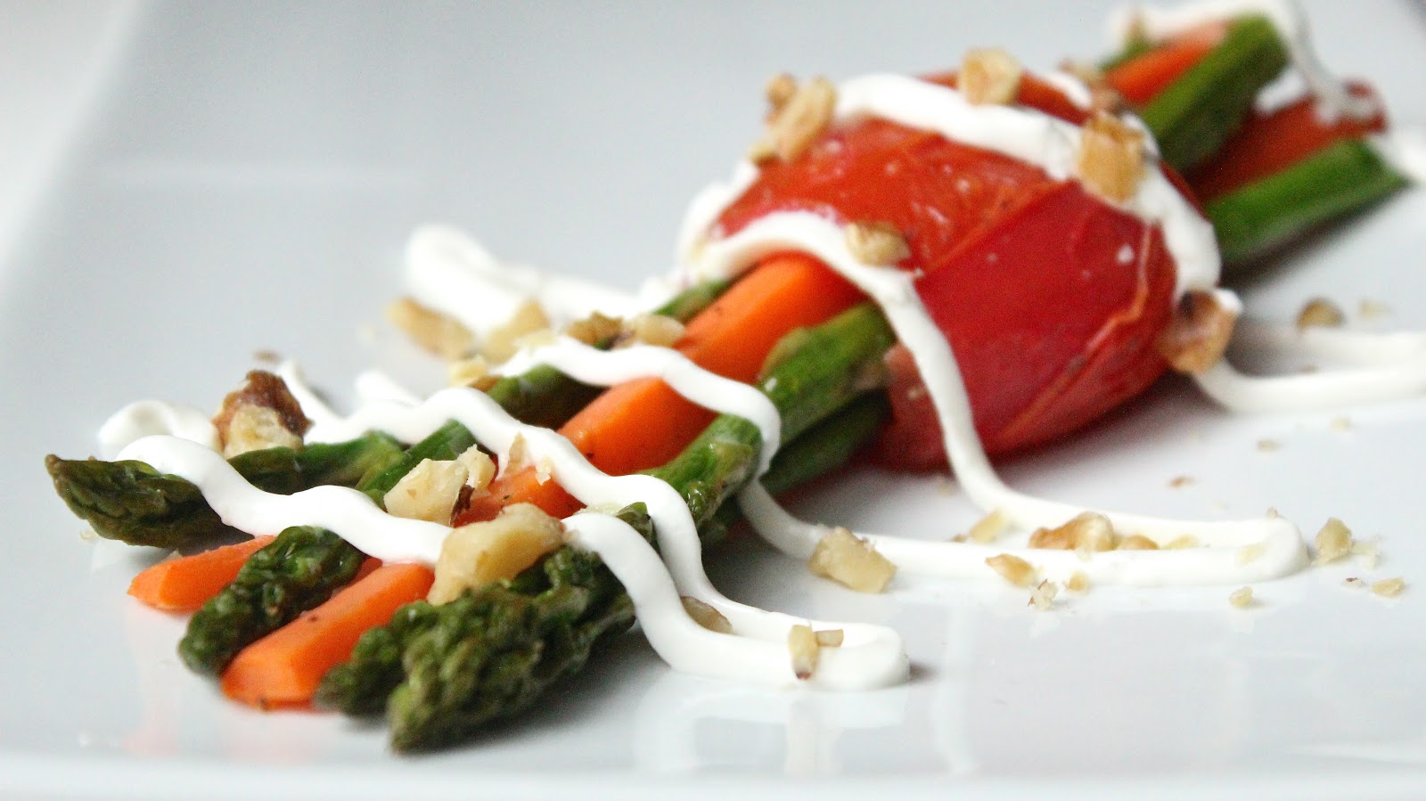 ROASTED ASPARAGUS CARROT BUNDLES WITH WALNUTS AND GOAT CHEESE DRIZZLE