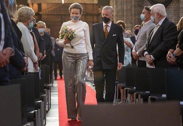 Queen Mathilde wore a new sequined Prince of Wales checked wool straight-leg pants, and white cashmere round neck sweater