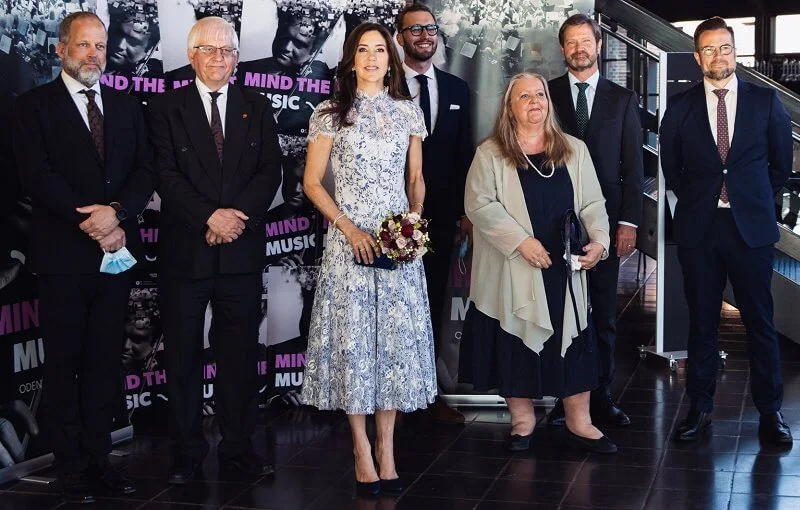 Crown Princess Mary wore a lace floral elodie dress from Moss & Spy, and  silk pumps from Gianvito Rossi. Prada satin clutch