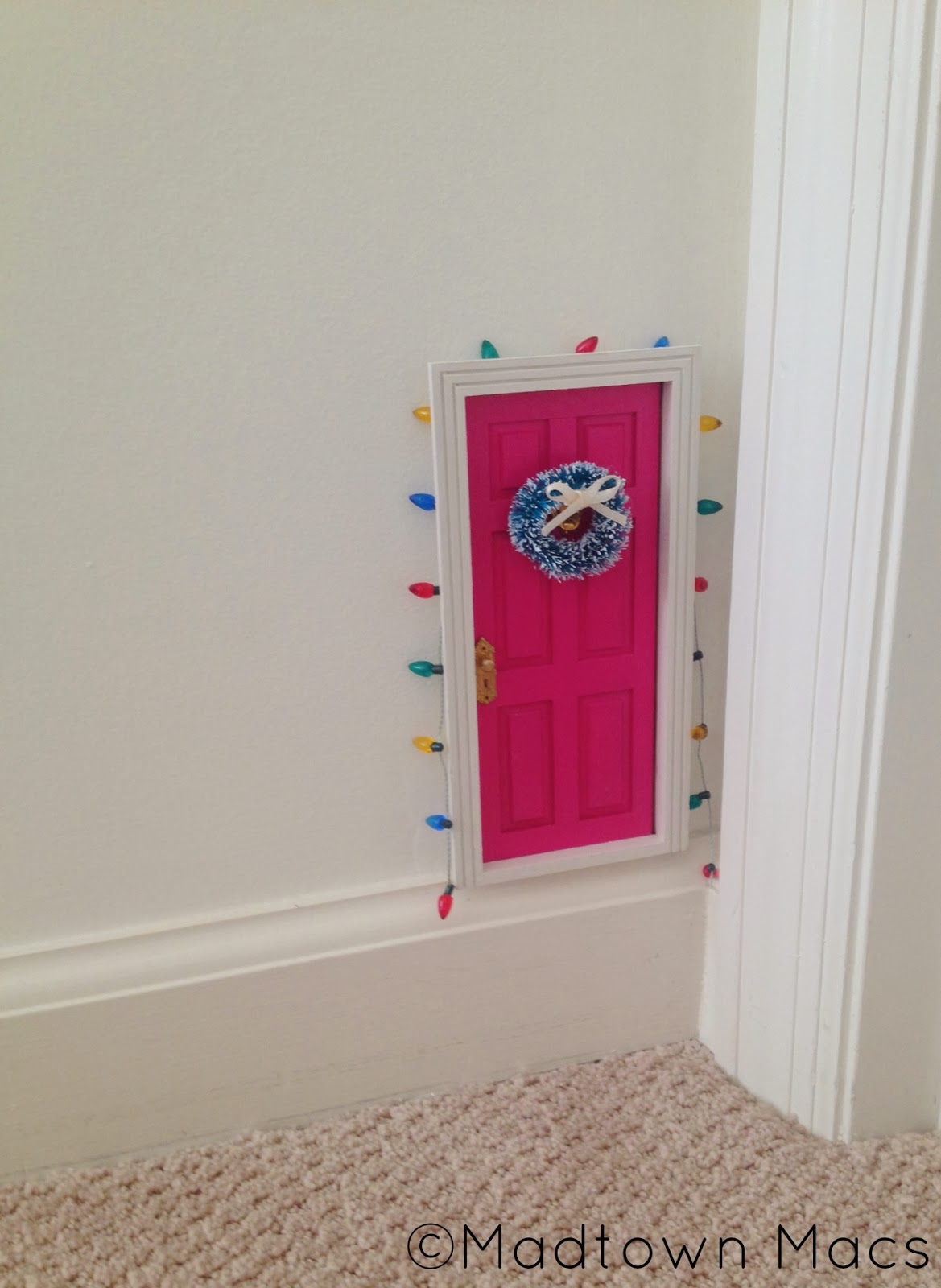 21 extravagant christmas decorations for your front door Christmas Fairy Door and Magic Window | Charisa Darling