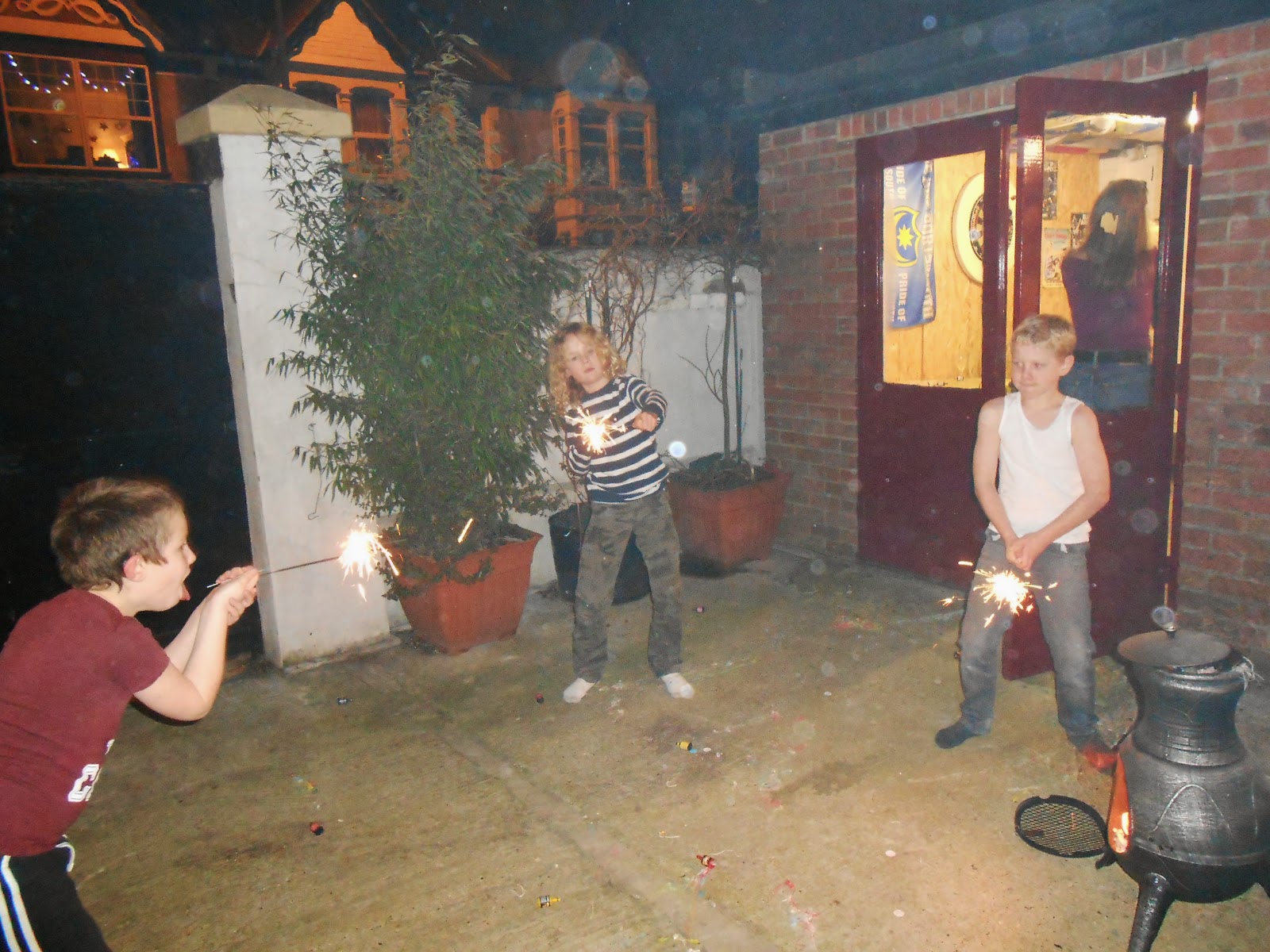 kids with sparklers in back yard