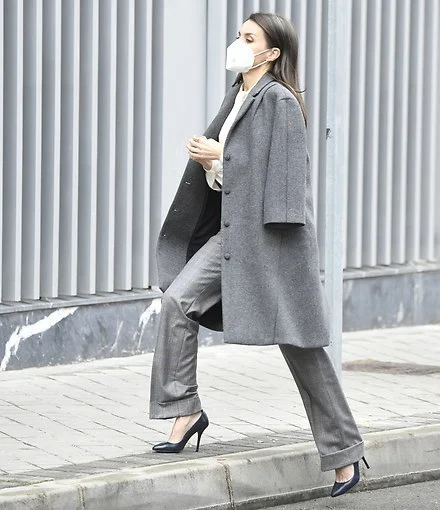 Grey swing coat from Nina Ricci, and bibosa silk bow blouse from Hugo Boss. Massimo Dutti Prince of Wales print trousers