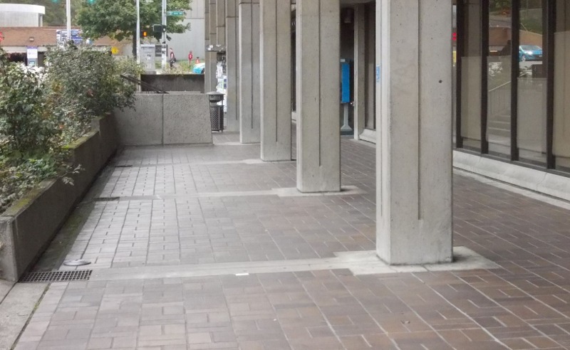 Otherwise wide walkway rendered narrow by stairs