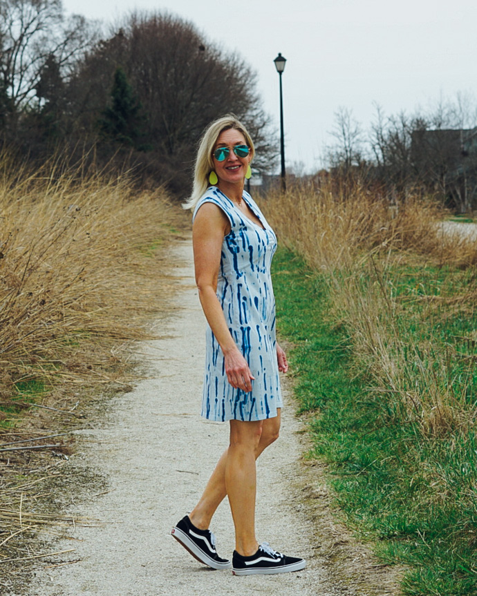 blue tie dye dress and Van's sneakers