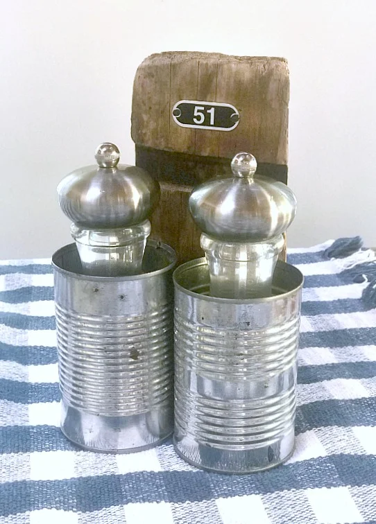 recycled cans with salt and pepper mills