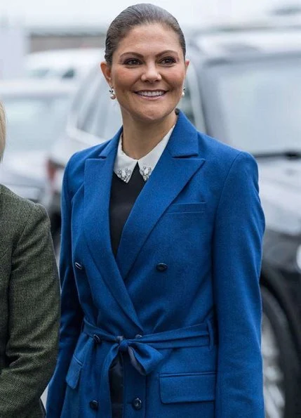 Crown Princess Victoria wore Af Klingberg Rakel Suede Nero Boots, Dagmar Taylor Tote Bag. Blue wool coat