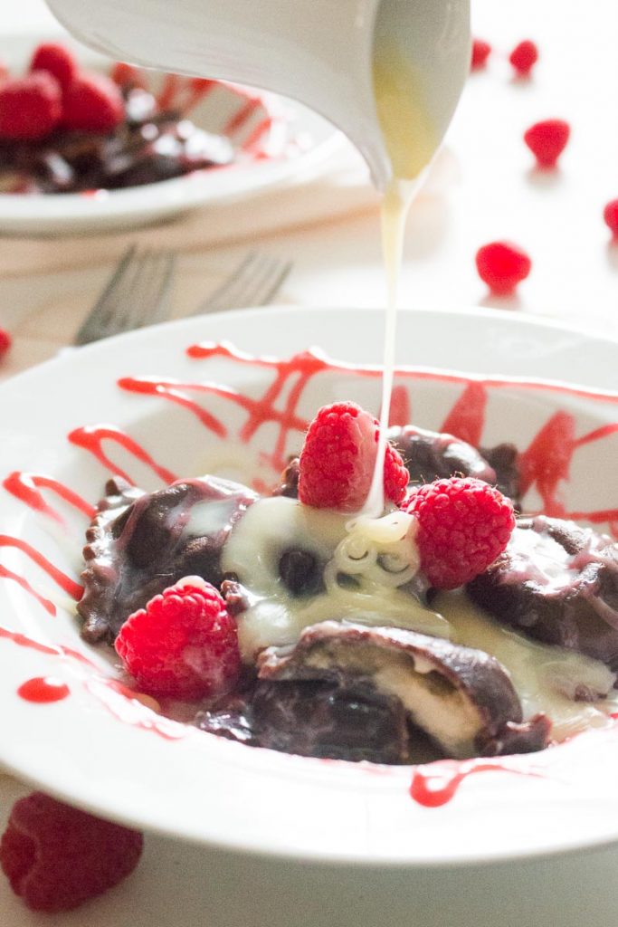 Chocolate Ravioli with White Chocolate Mascarpone and Raspberry Sauce - This chocolate ravioli with white chocolate mascarpone filling and raspberry sauce is an elegant, romantic, and unique dessert that is sure to impress!