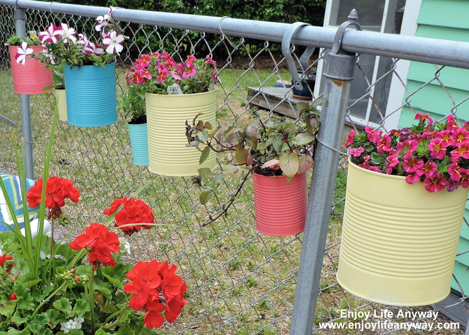 Enjoy Life Anyway Dress Up A Fence With DIY Tin Can Planters