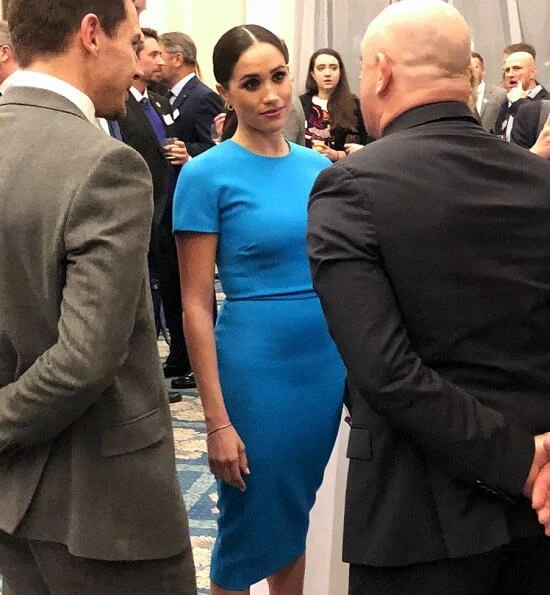 Meghan Markle wore Victoria Beckham pencil midi dress. Meghan, Duchess of Sussex and Prince Harry, Duke of Sussex