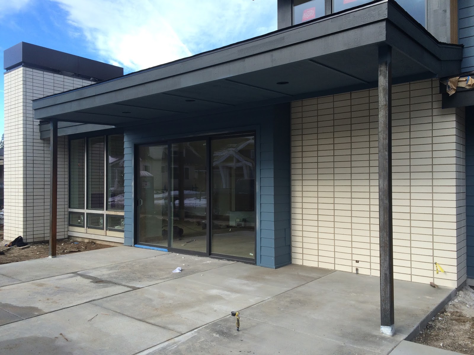 BOISINEAU MASONRY Stacked Bond Brick Chimney in Northwest Crossing