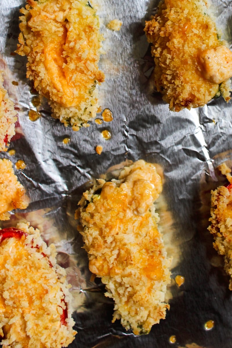 Baked Jalapeño Poppers | The Two Bite Club | #appetizer #jalapenos Baked Jalapeño Poppers are a healthier version of fried jalapeño poppers! Fresh stuffed jalapenos are rolled in panko breadcrumbs and baked in the oven until the outside is golden and crispy and the inside is melty and cheesy. #appetizer #jalapenos
