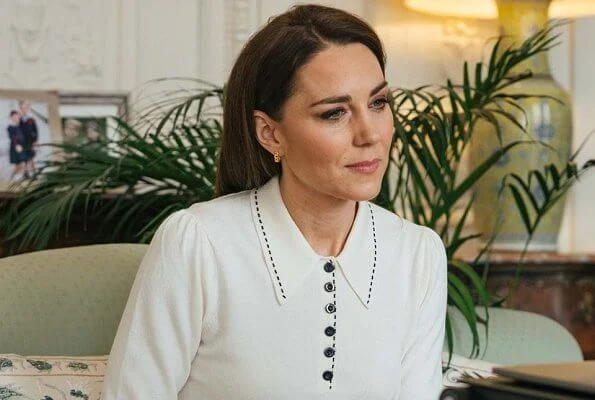 Kate Middleton wore a new cotton merino collared jumper from LK Bennett. Astley Clarke earrings