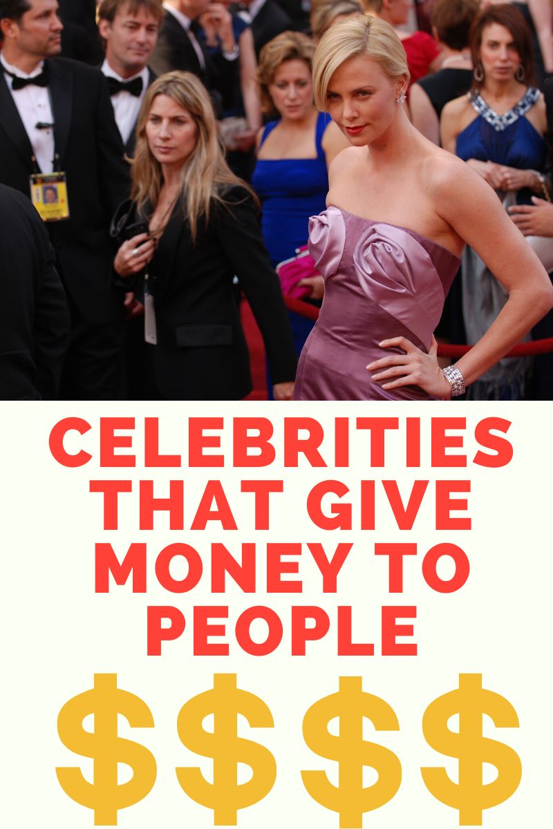 Celebrities giving money to charity at a public event.
