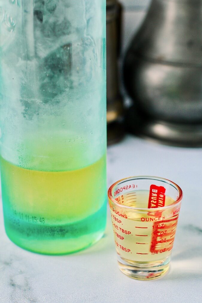 Limoncello in a bottle and shot glass