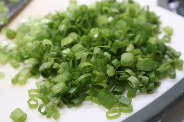 green onion all chopped up on the cutting board