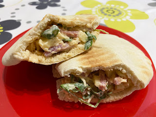 Pita stuffed with bacon, cheese, apple and lettuce