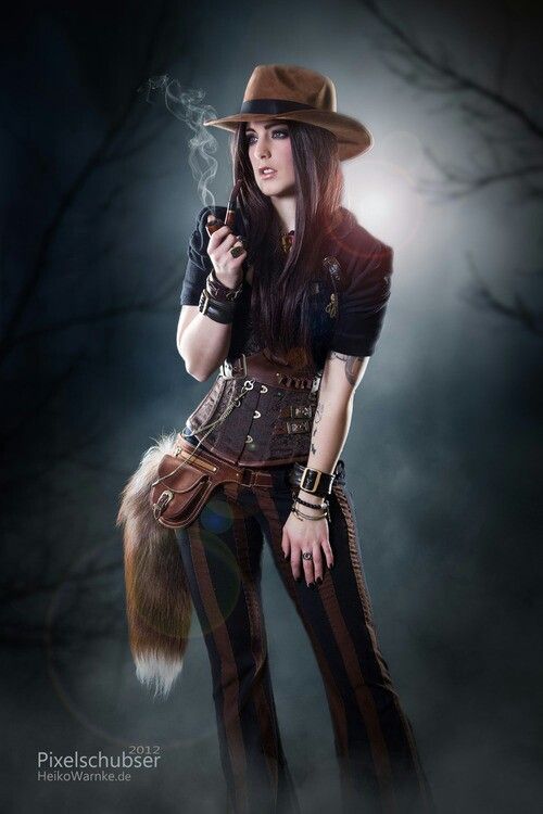 Steampunk woman in striped pants, corset, and hat, smoking a pipe, with a fur fox tail.