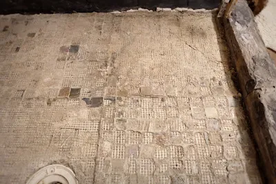 removed floor tile shower concrete