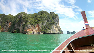 Longtail boat ride from Ao Nang to Railay - The bow of our longtail boat with cliffs in background