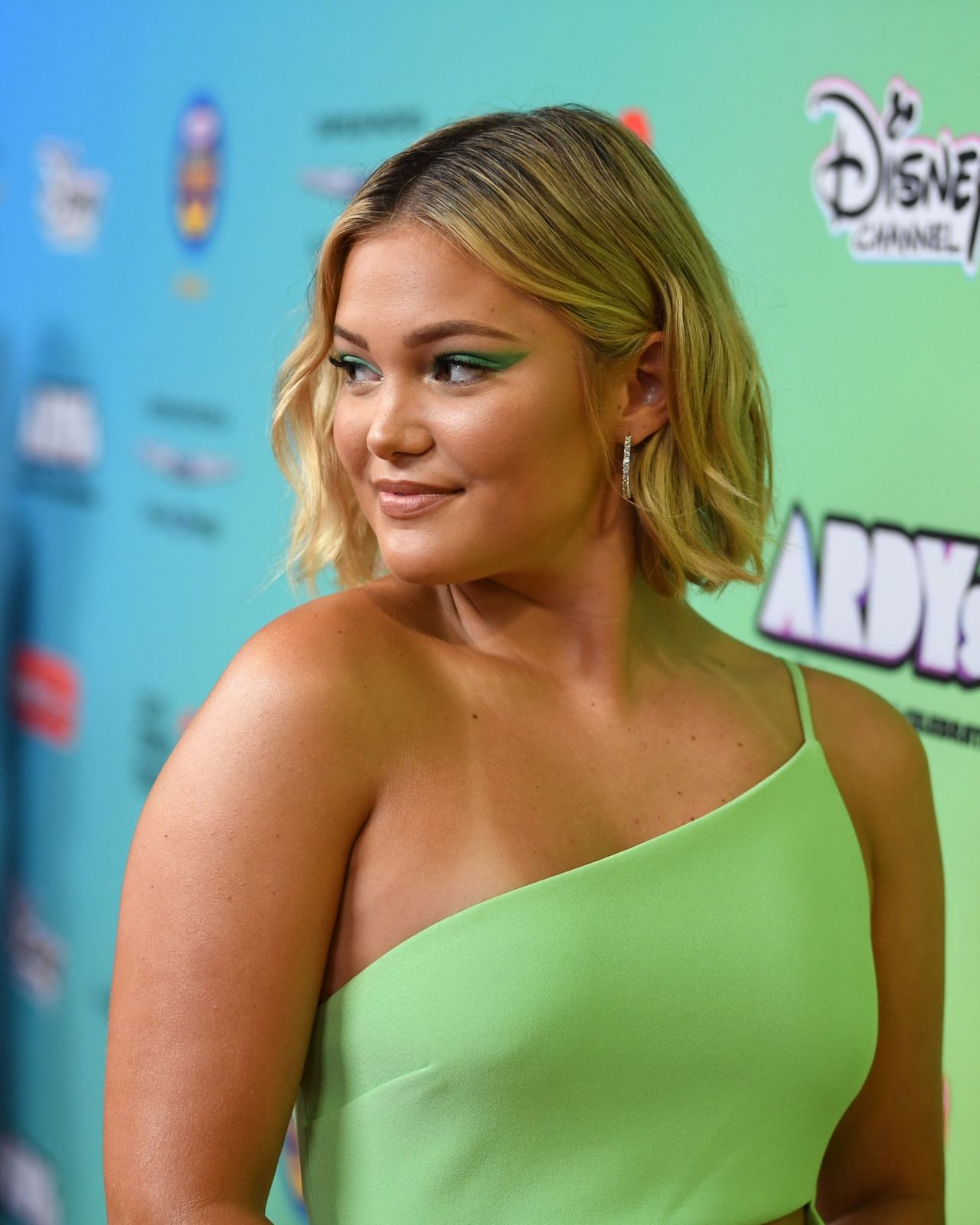 Olivia Holt wears mint dress to the 2019 Radio Disney Music Awards in