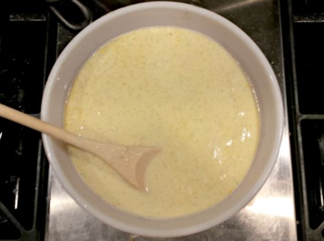 ice cream base in bowl with wooden spoon