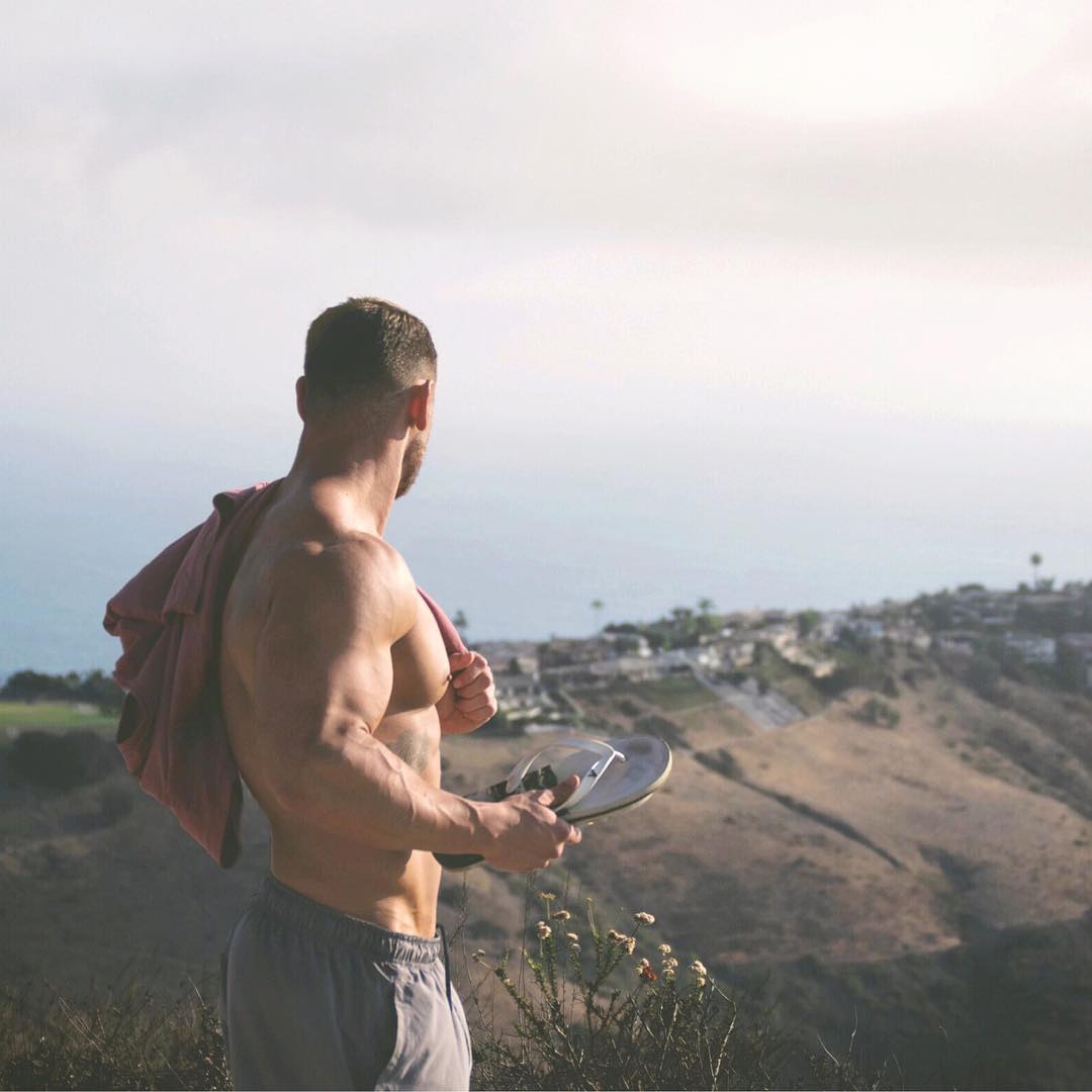 handsome-fit-shirtless-man-enjoying-killer-city-view