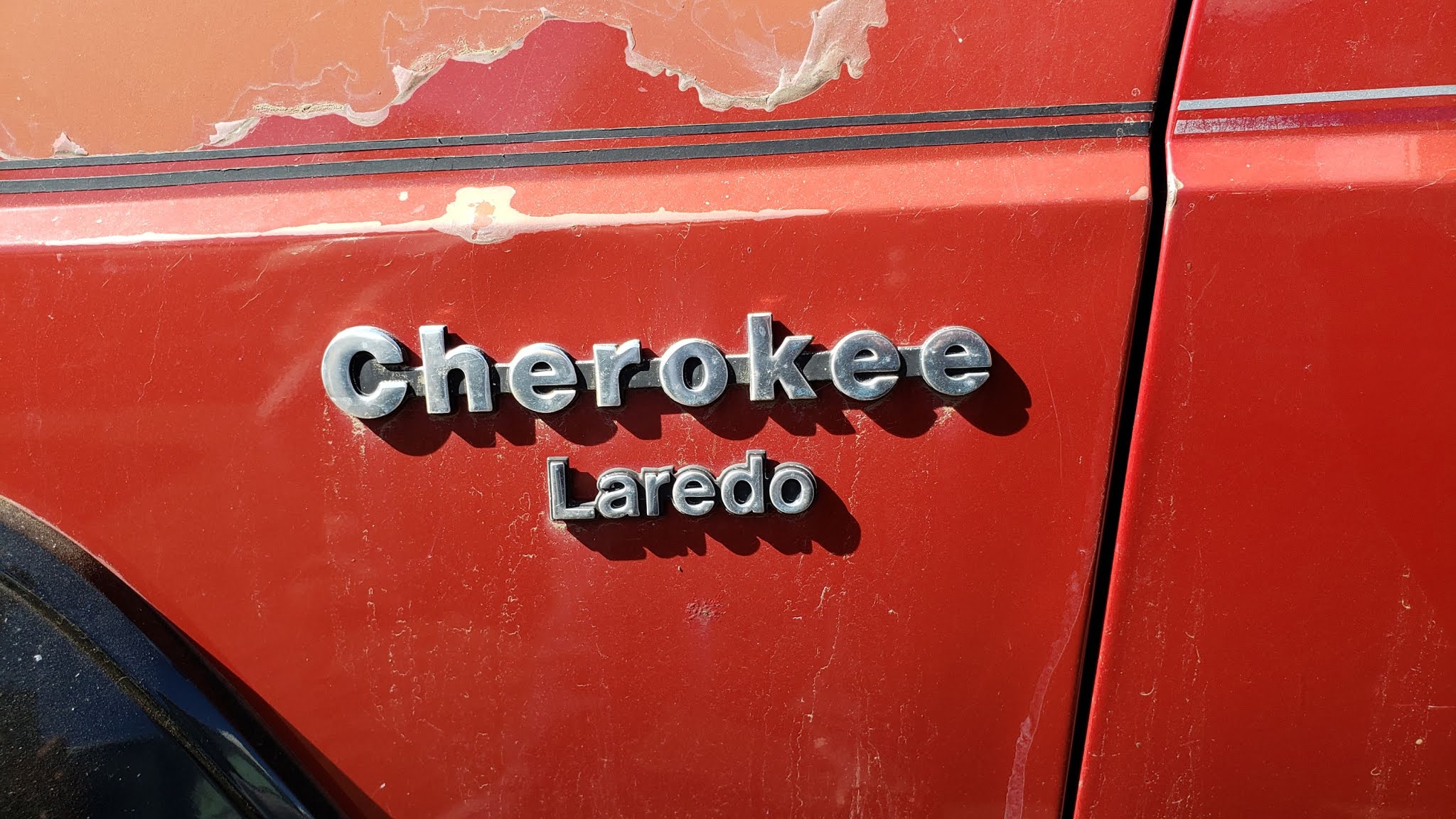 Junked Jeep Cherokee Laredo 1990.