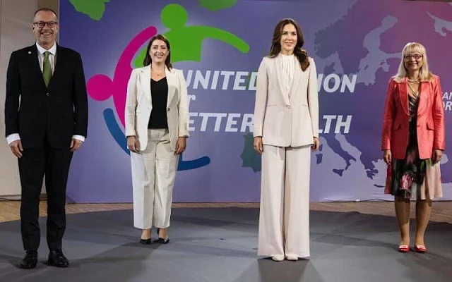 Crown Princess Mary wore a cecel SP blazer and Gytta trousers from Andiata. She carried Prada saffiano cuir double bag