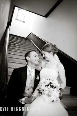 Bride and Groom seated on steps at Chase Court