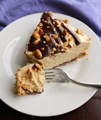 This peanut butter pie has it all; a pretzel crust coated with a layer of chocolate filled with creamy peanut butter goodness. There is no whipped topping in site, but it is still super easy to make! first bite of no bake peanut butter pie on fork and ready to eat