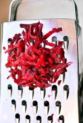 Grate the beets directly into the bowl Grate the beets directly into the bowl