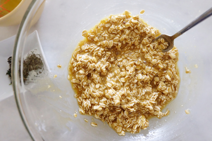 oats mixed in with oil, eggs, and brown sugar
