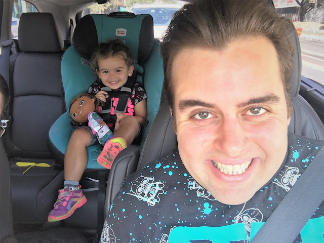 On our way to Supercon: Looey and Leia Looey in the front seat and Leia in the backseat, both smiling.