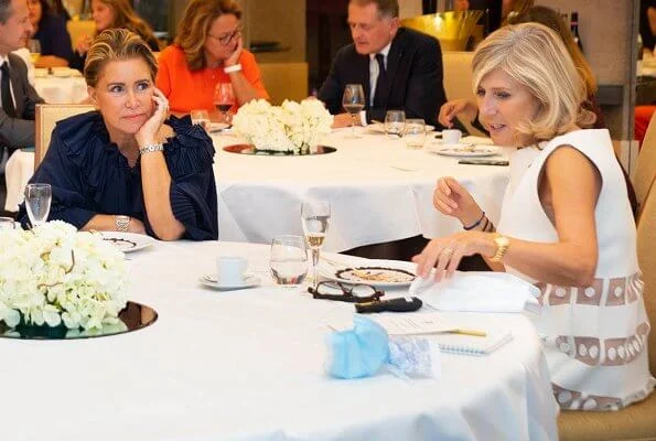 Grand Duchess Maria Teresa wore a navy blue round neck puff sleeve ruffled blouse