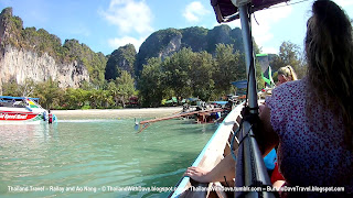 Coming to shore in longtail boat by Railay West