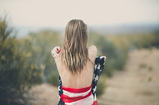 woman wrapped in American flag