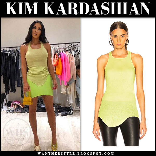Kim Kardashian in yellow tank top and neon mini skirt on September 2 ...