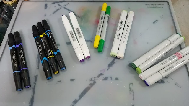alcohol markers, Prismacolor markers, Copic markers, Blick Studio Brush Markers, Shin Han Twin Touch markers 