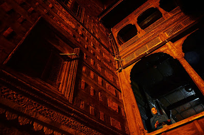 A Kashmiri Muslim woman embraces an inner wall of the 600-year-old shrine of Syed Mir Ali Hamdani, during the annual Urs in downtown Srinagar.