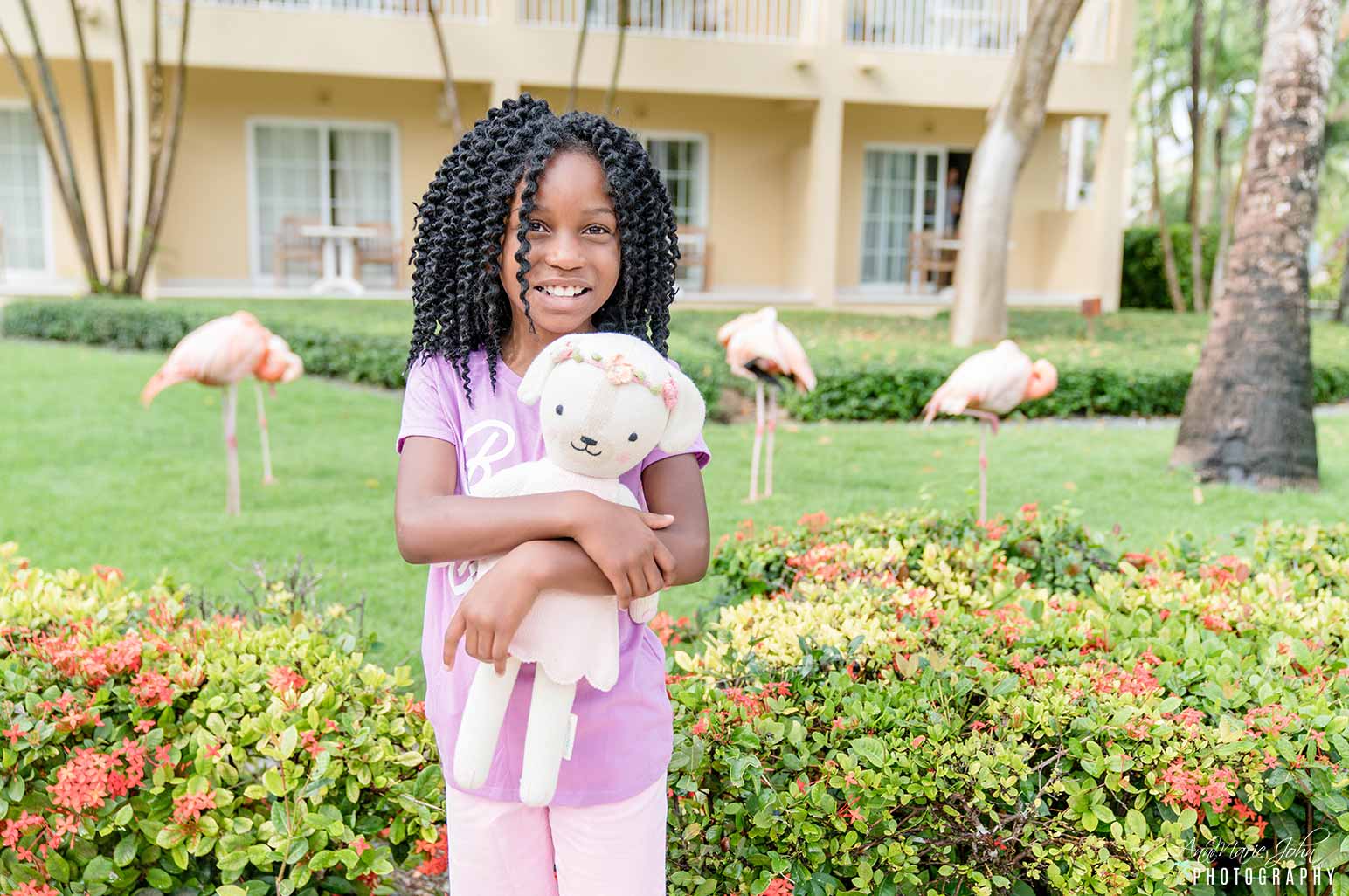 Child holding stuffed animal