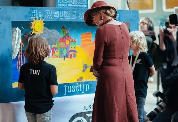 Queen Maxima wore Natan burgundy belted midi dress, and Delvigne hat, Natan pumps