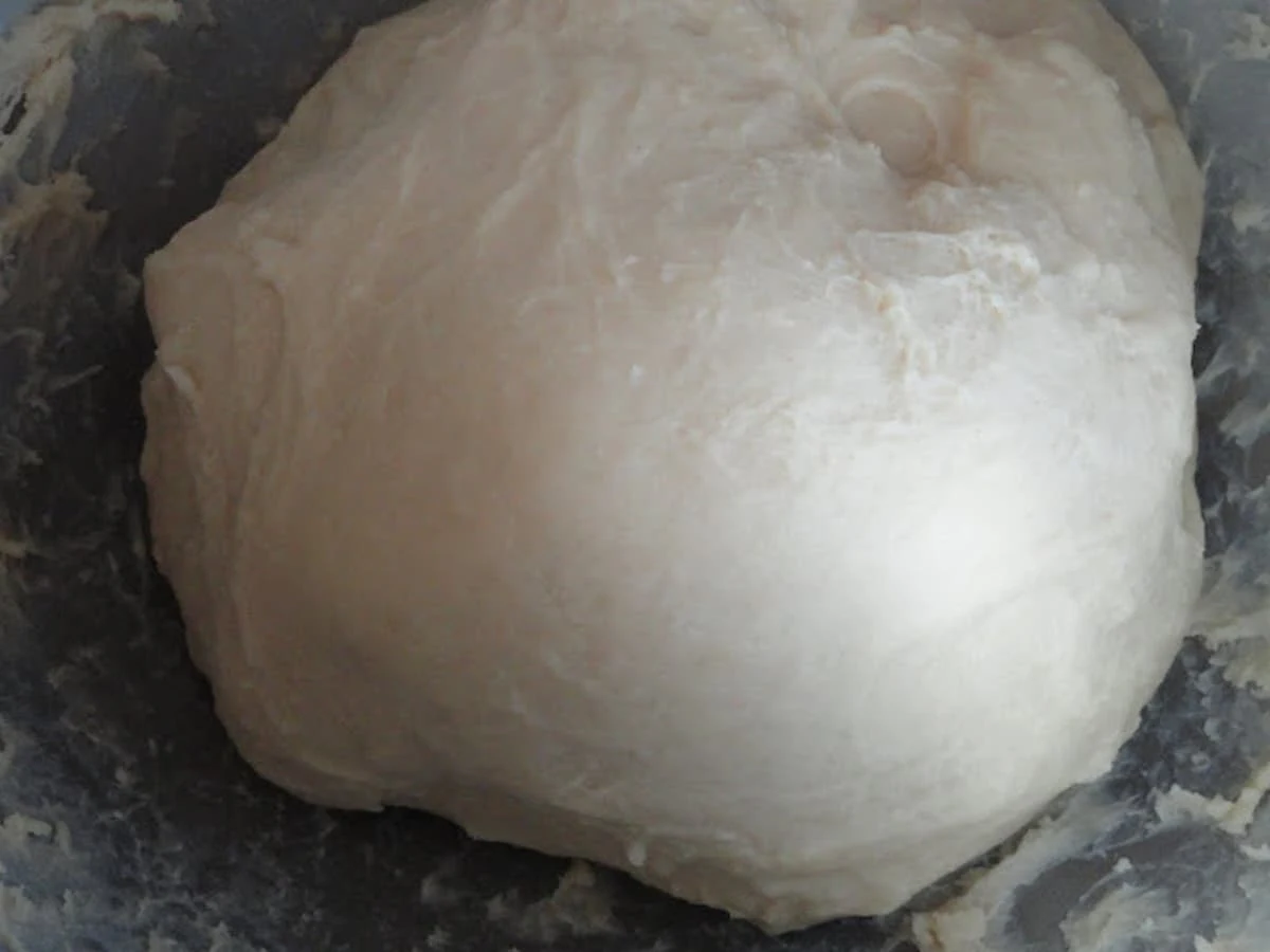 A resting ball of Homemade Egg Noodle Dough.