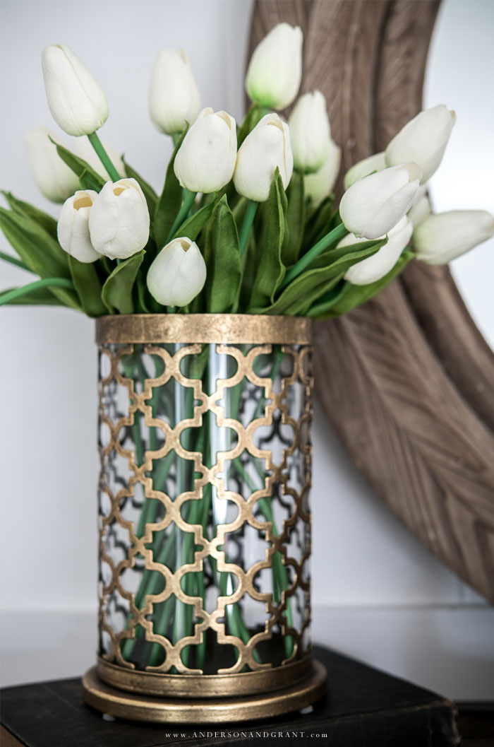Brass vase of white real-touch tulips