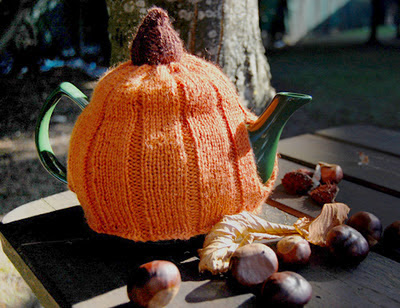 http://buttonsandbeeswax.com/patterns/free-knitting-patterns/halloween-pumpkin-tea-cosy/