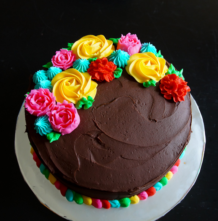 Cinco de Mayo Cake with bright buttercream flowers and a colorful border