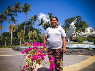 Woman Traveler In Front Of Tropical Garden Park With Horse Statues On A Sunny Day At Tangguwisia Village North Bali Indonesia