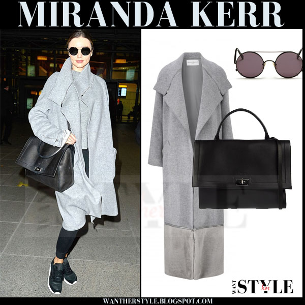 Miranda Kerr in grey wool coat and black sneakers at Heathrow airport