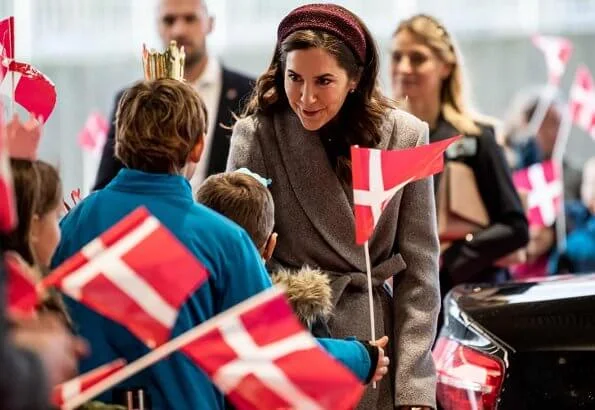 Crown Princess Mary attended the opening of Viborg Regional Hospital's new emergency center. burgundy blouse, grey midi dkirt, grey wool coat