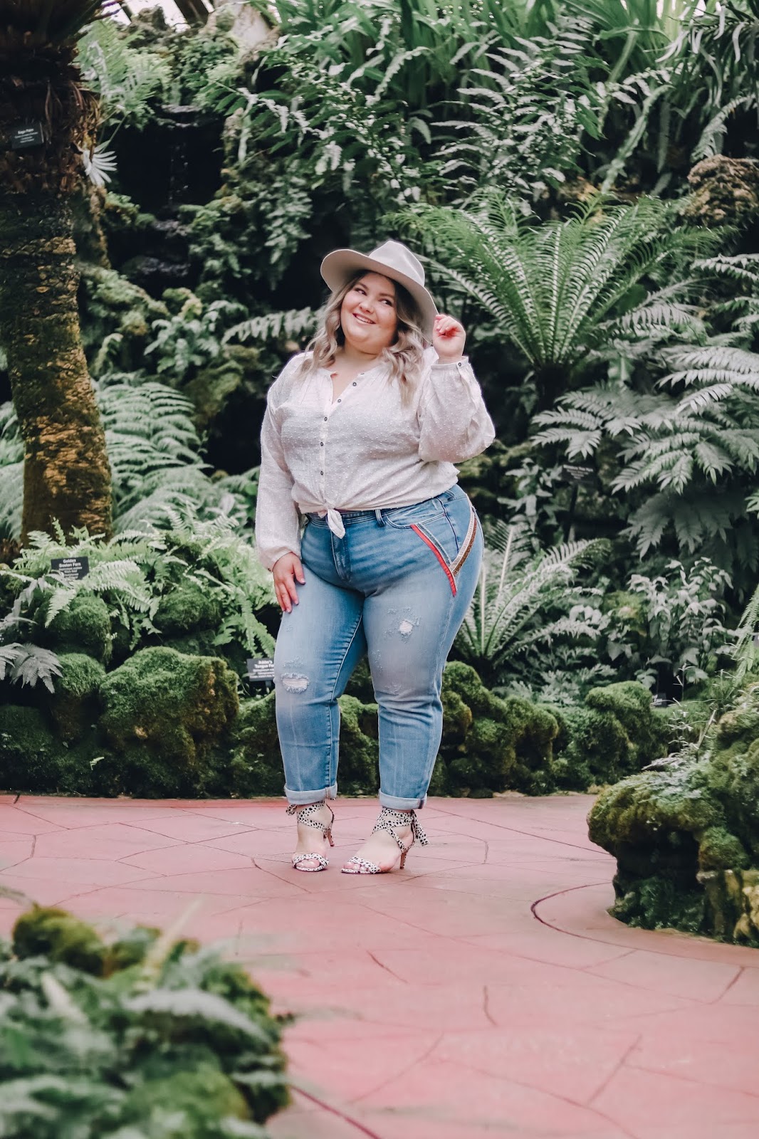 Chicago Plus Size Petite Fashion Blogger, influencer, YouTuber, and model Natalie Craig, of Natalie in the City, reviews Anthropologie's denim, blouses, hats, and heels.