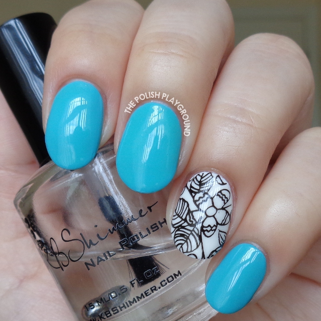 Turquoise Blue with Black and White Floral Accent Nail Art